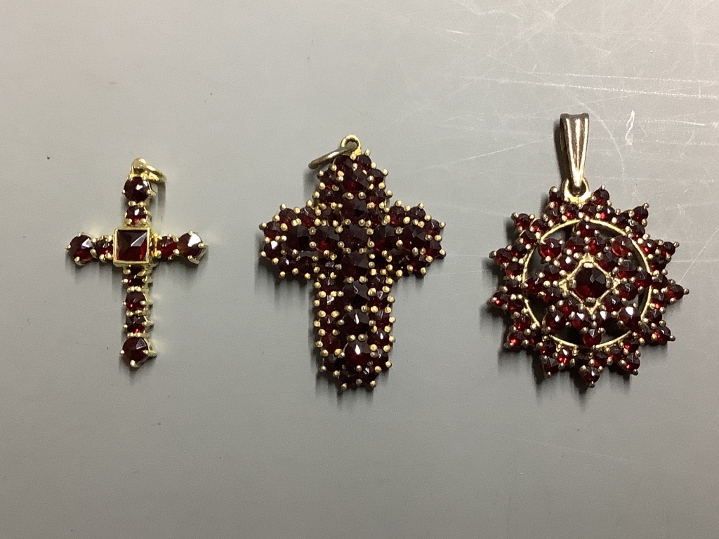 A group of facetted garnet set jewellery, including brooches, pendants and ear studs